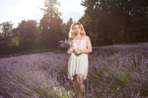 Lifestyle Portrait of a Beautiful Women Enjoying a Summertime Lavender Field in Bloom