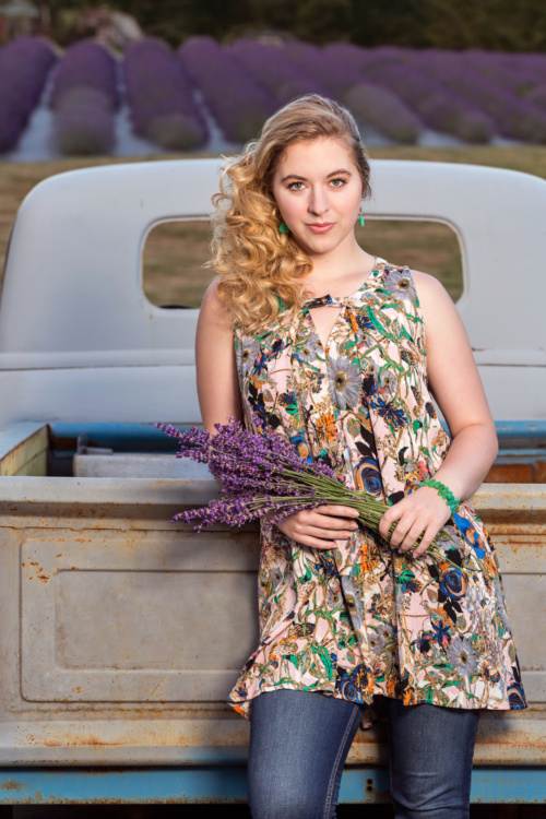 Lifestyle Portrait of a Beautiful Women Enjoying a Summertime Lavender Field in Bloom