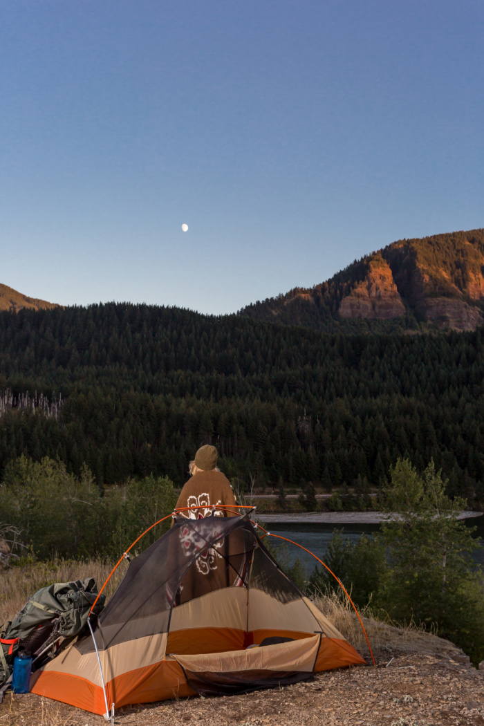 Beautiful Happy Women Backpacking Alone in a Remote Wilderness Area and Enjoying the Moment of Solitude and Beauty