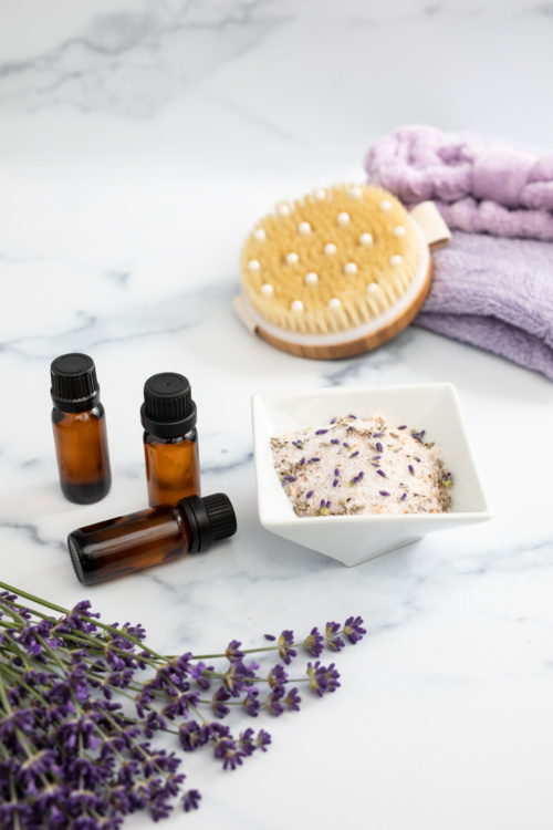 Lavender Essential Oils Styled on Marble Countertop Ideal for Relaxation and Self Care at Home