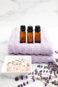 Lavender Essential Oils Styled on Marble Countertop Ideal for Relaxation and Self Care at Home