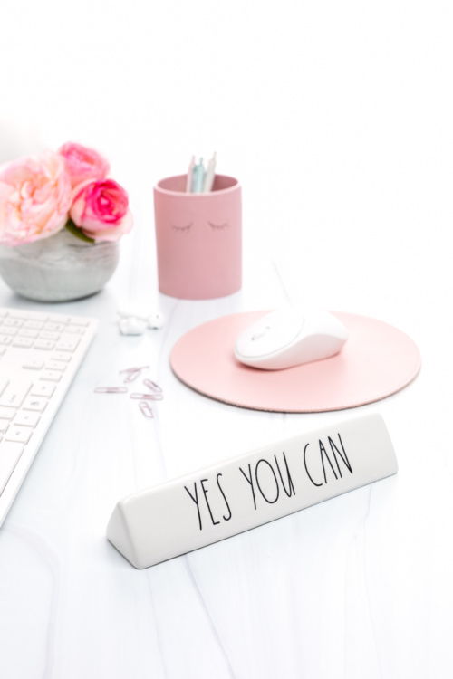 Pink and White Styled Desktop Featuring a Motivational Message