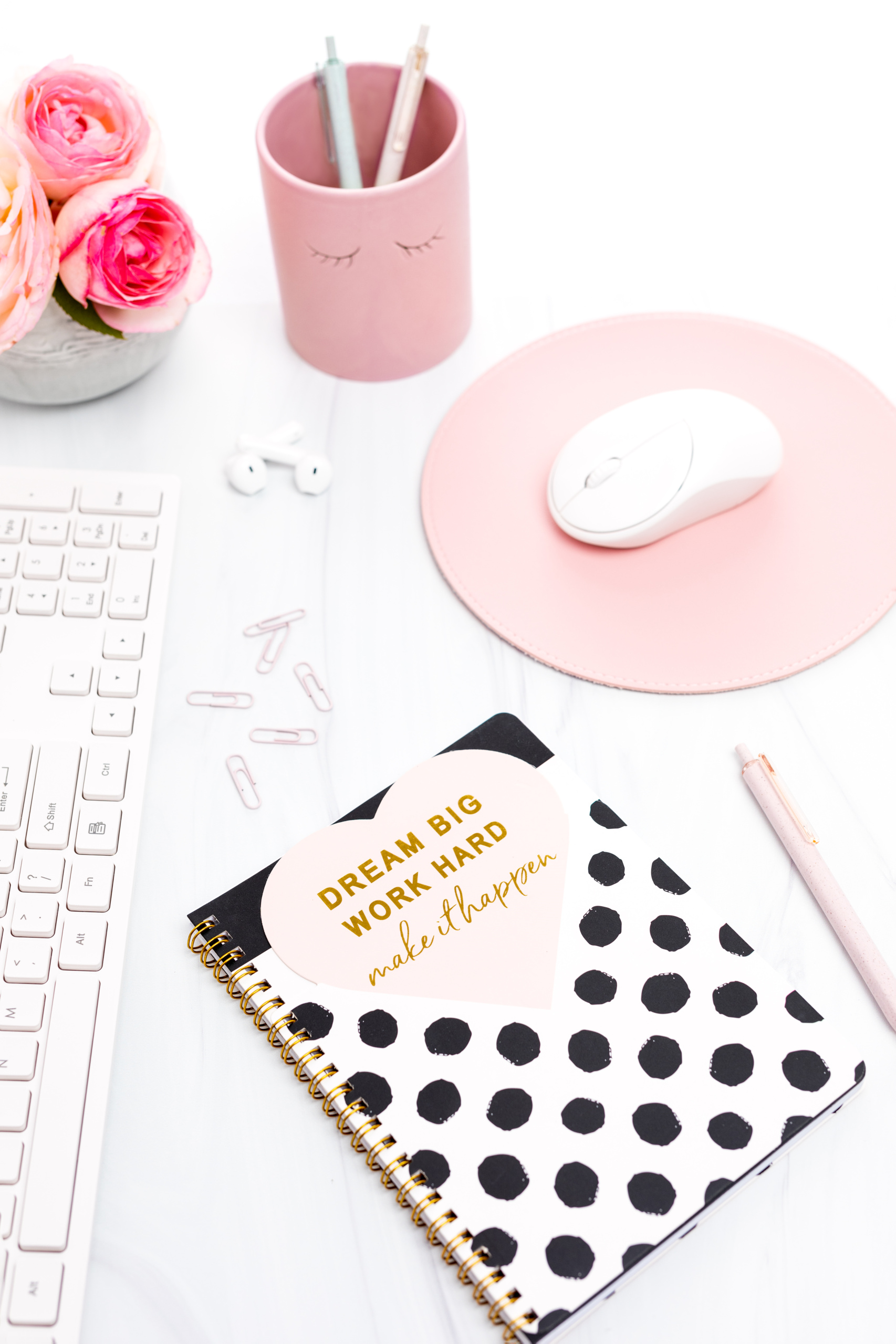 Pink and White Styled Desktop Featuring a Motivational Message